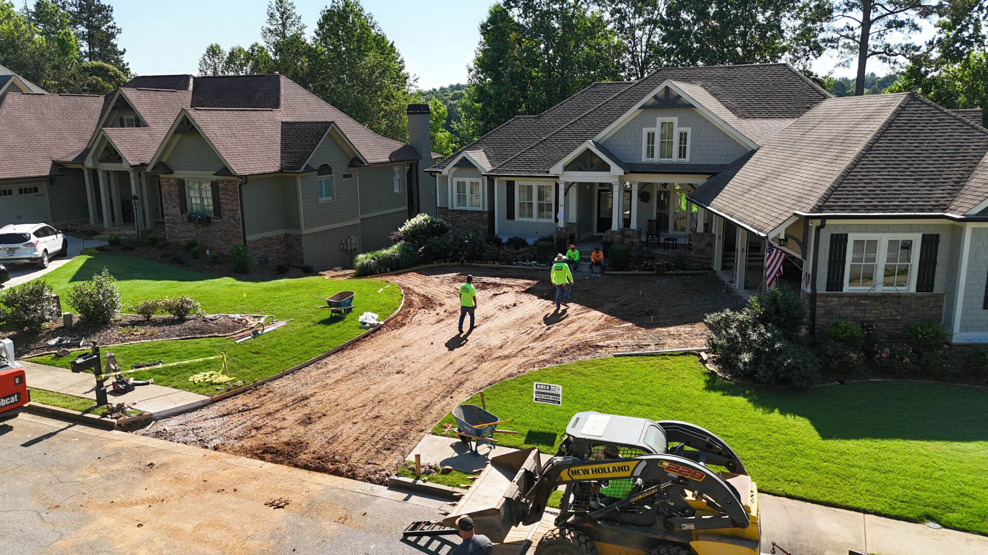 Boss concrete working on driveway